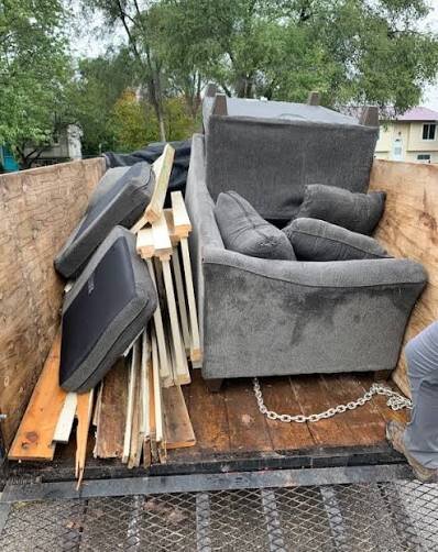 FC Junk Removal truck loaded with furniture